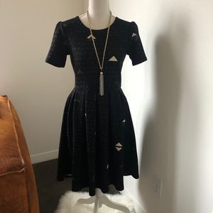 Black and beige fit and flare dress